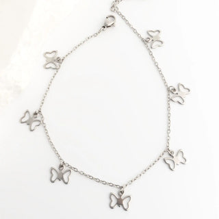 Silver butterfly bracelet on a white background
