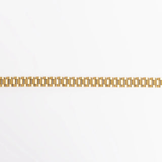 Gold bracelet on a white background