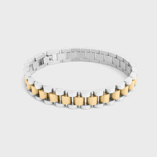 Two-tone metal bracelet on a light gray background