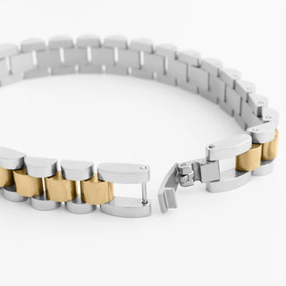Two-toned silver and gold bracelet on a white background