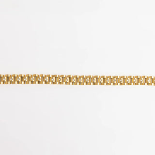 Gold bracelet on a white background