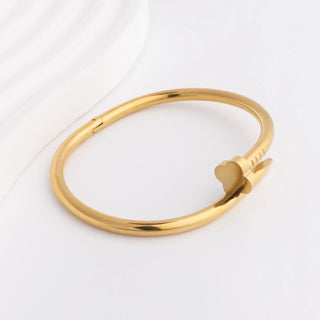 Gold bracelet on a white background