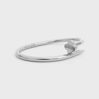Silver bracelet on a light gray background