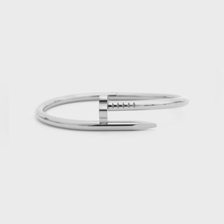 Silver bracelet on a light gray background