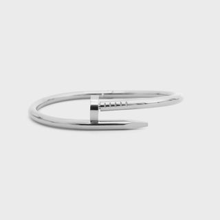 Silver bracelet on a light gray background