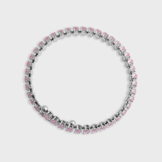 Bracelet with pink and silver beads on a light gray background