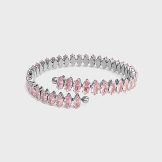 Silver bracelet with pink gemstones on a light gray background
