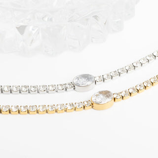 Two diamond bracelets on a white background