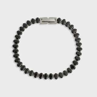 Black beaded bracelet with a silver clasp on a white background