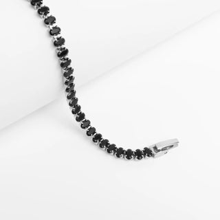 Black beaded necklace on a white background