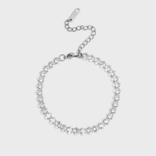 Silver chain bracelet on a light gray background