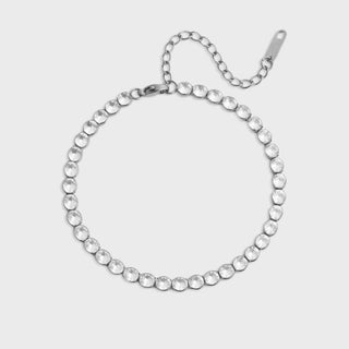 Silver bracelet with clear stones on a white background