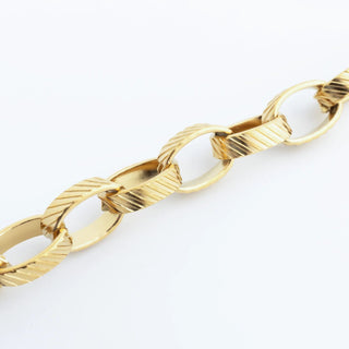 Gold chain bracelet on a white background