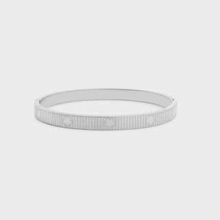 Silver bracelet on a light gray background