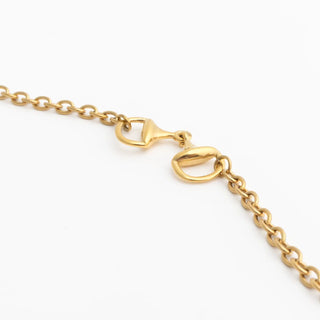 Gold chain Horsebit Bracelet with clasp on a white background