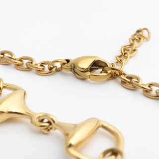 Gold chain Horsebit Bracelet with a clasp on a white background