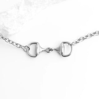 Silver bridle bit Horsebit Bracelet on a white background