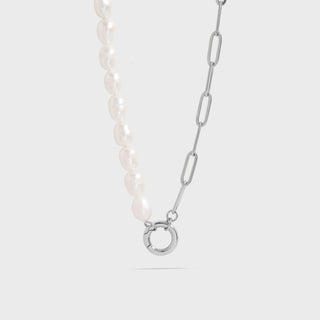 The Destin Necklace displayed on a white background, featuring a split chain design with freshwater pearls and Stainless Steel paperclip links, joined by a round charm holder clasp