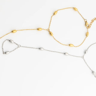 Gold and silver Statement Bead Hand Chains on a white background