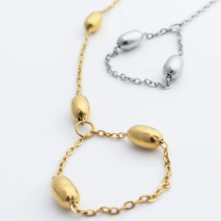 Gold and silver Statement Bead Hand Chains on a white background
