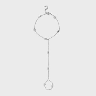 Silver hand chain with a y-style clasp on a light gray background