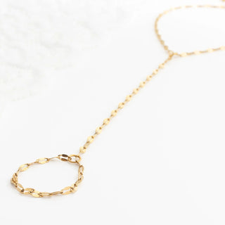Gold Lip Hand Chain on a white background