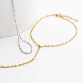 Gold and silver Singapore Hand Chains on a white background