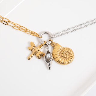 Necklace with gold and silver charms on a white background