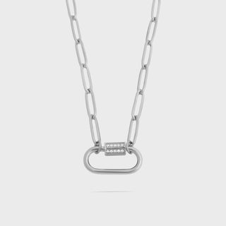 Silver chain necklace with a unique clasp on a light gray background