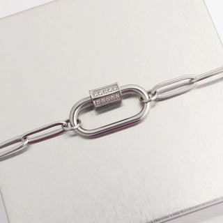 Silver chain bracelet with a clasp on a white background