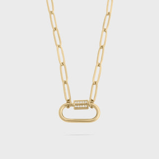 Gold chain necklace with a unique clasp on a light gray background