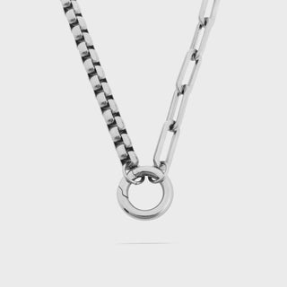 Silver chain necklace on a white background