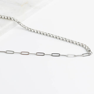 Silver chain necklace with small diamonds on a white background