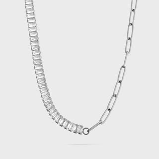 Silver necklace with rectangular gemstones on a light gray background