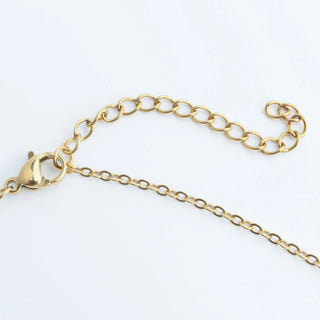 Gold chain bracelet on a white background