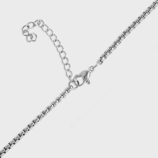 Silver chain necklace on a white background