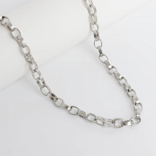 Silver chain necklace on a white background