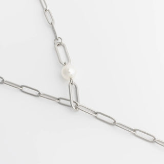 Silver chain necklace with a pearl pendant on a white background