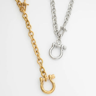 Gold and silver chain necklaces on a white background