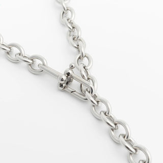 Close-up of a silver chain on a white background
