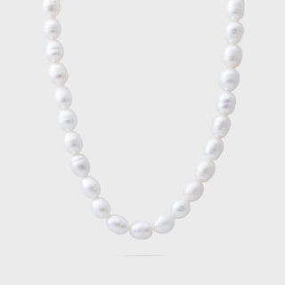 Pearl necklace on a light gray background