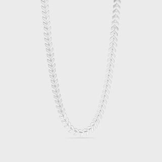 Silver necklace with leaf-like pendants on a light gray background