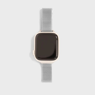 Smartwatch with a silver mesh band on a light gray background