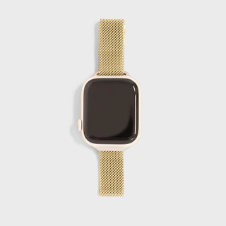 Gold smartwatch with mesh band on a light gray background
