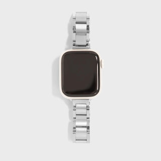 Smartwatch with a silver metal band on a light gray background