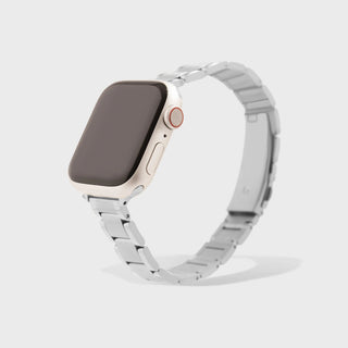 Smartwatch with a silver metal band on a light gray background