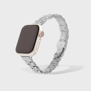 Smartwatch with a silver metal band on a light gray background
