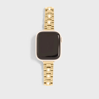 Gold smartwatch on a light gray background