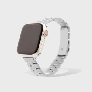 Smartwatch with a silver metal band on a light gray background