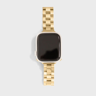Smartwatch with a gold metal band on a light gray background